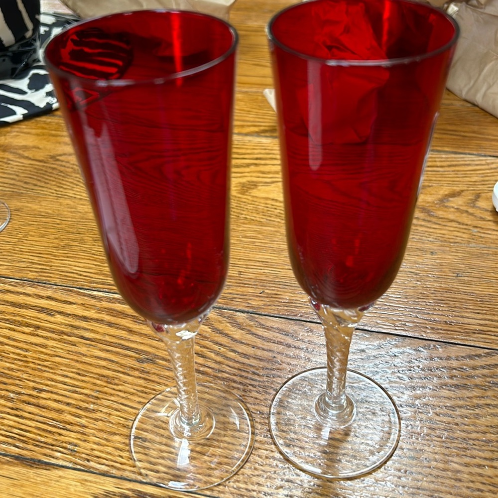 Ruby red stemware glasses with clear stem and base.  Twisted stems. Set of 2.